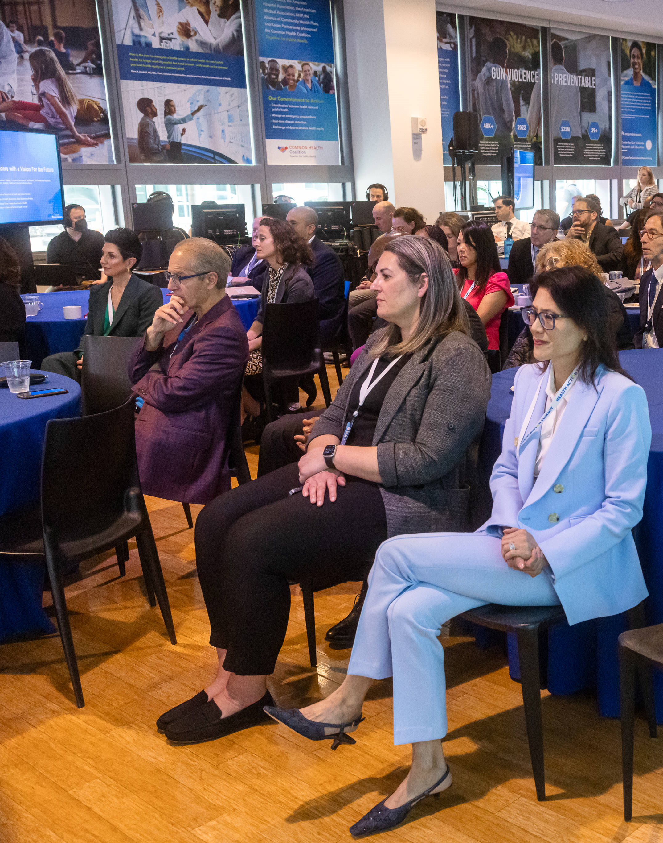 group of people listening to a speaker